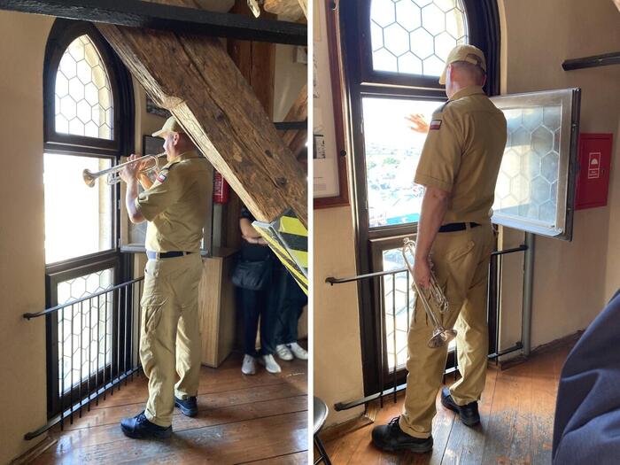 目の前で演奏する塔のラッパ奏者